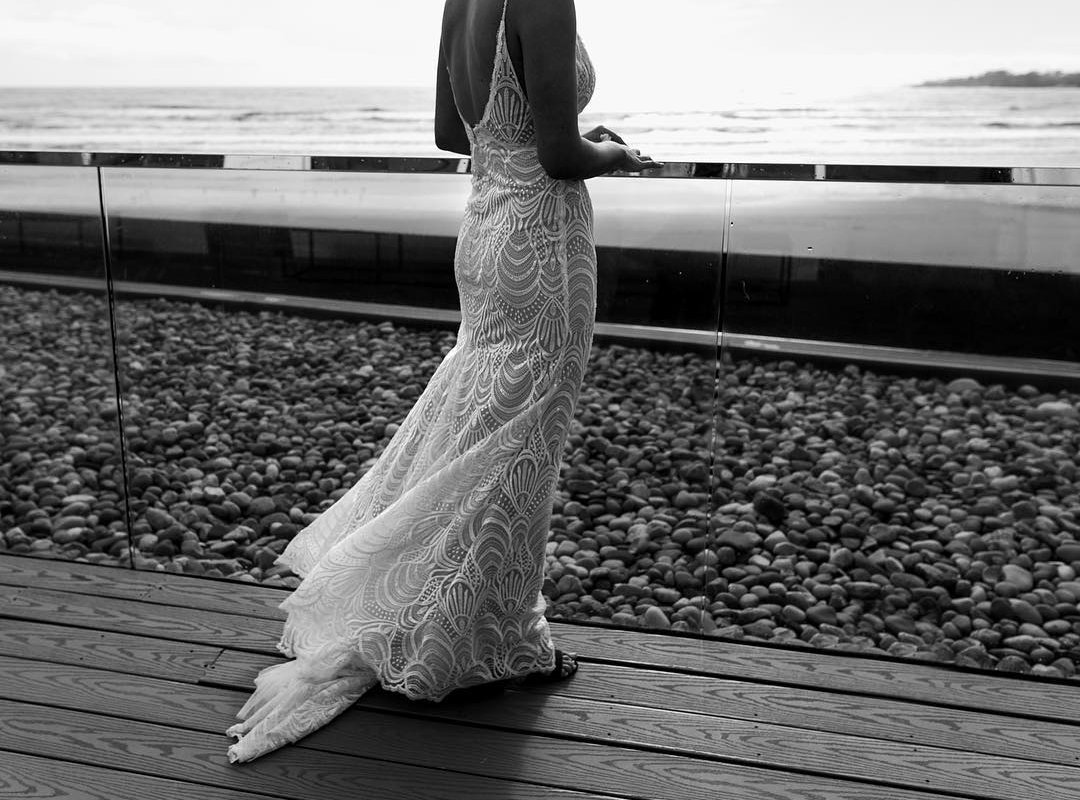 Newport Beach House-Eventide balcony-Bride with Lace Dress facing Ocean-booking your wedding venue_Madison Hope Photography